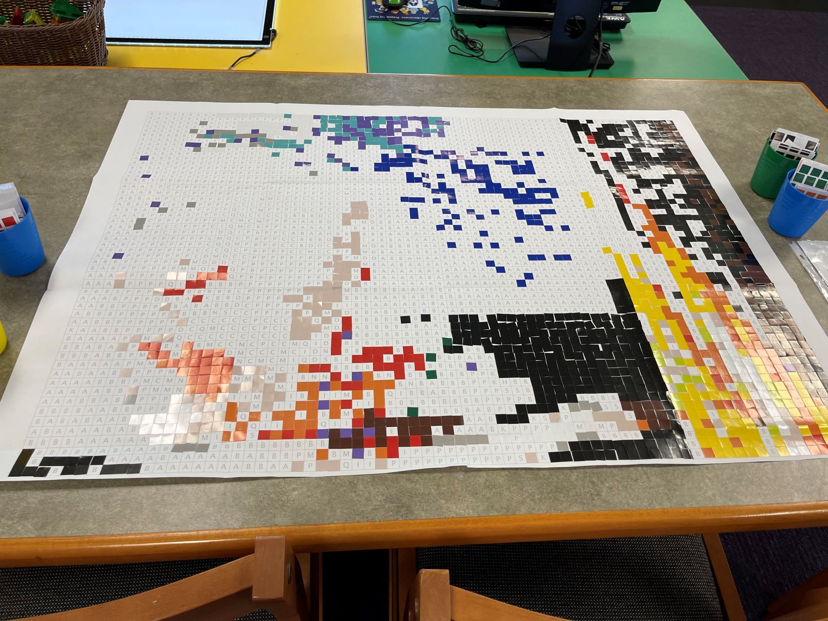 Sticker mosaic activity at the Lomira Quad/Graphics Community Library.